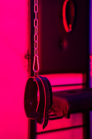 Installation. Wall with chains and handcuffsの写真素材