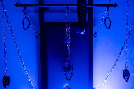 Installation. Wall with chains and handcuffsの写真素材