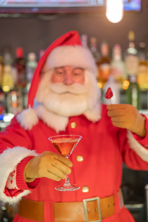 Santa Claus drinking a cocktail at a barの写真素材