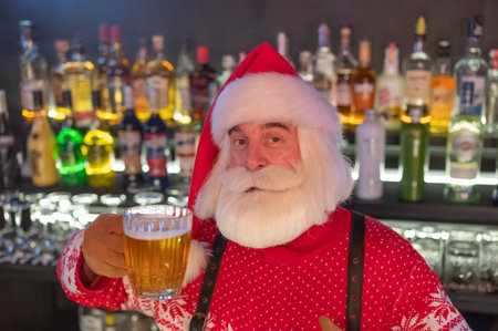 Santa Claus drinking beer in a pubの写真素材
