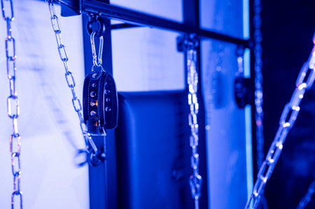 Installation. Wall with chains and handcuffsの写真素材