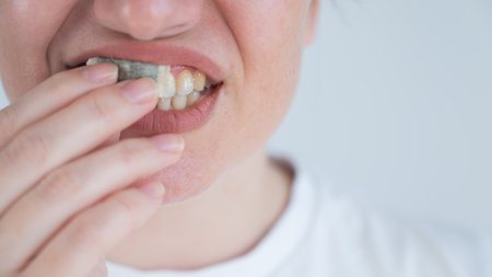 A woman uses chewing tobaccoの写真素材