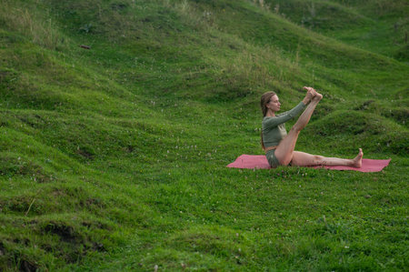 Caucasian woman doing yoga outdoors