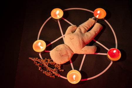 Voodoo doll on a pentagram. Witch spellsの写真素材