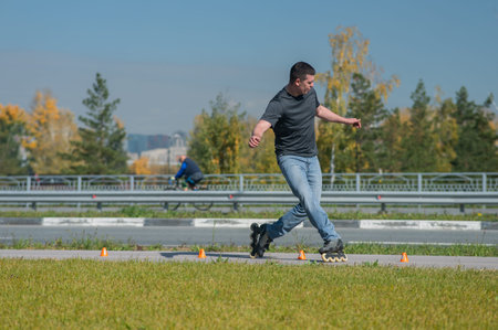 A Caucasian man rollerblades around the slalom course