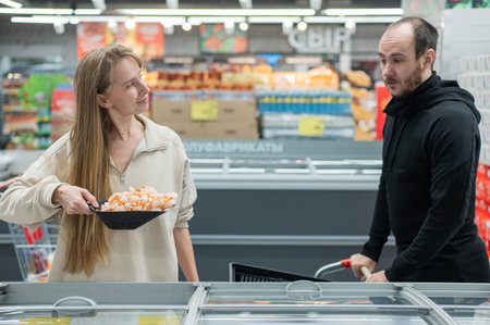 A Caucasian couple shopping in a supermarketの写真素材