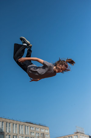 A girl jumps in the air