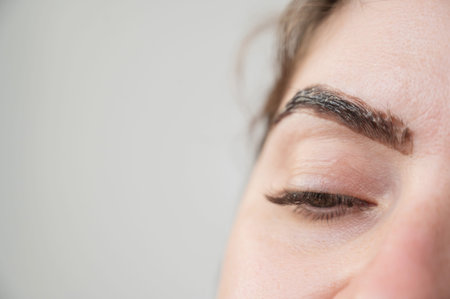 Caucasian woman getting eyebrow tinting procedure