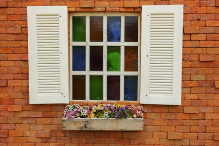 White windows on brick wallの写真素材