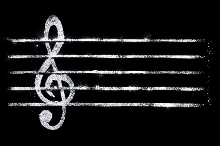 Treble clef on a black background for filling with cooking objectsの写真素材