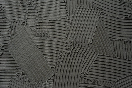 Cement on the wall caused by strokes. Concrete texture.の写真素材