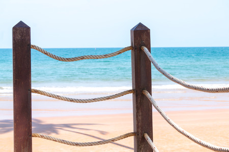rope of fence and sea backgroundの写真素材