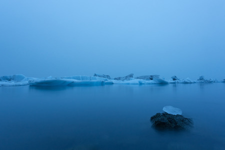 Iceberg in lagoon at midnight. Long exposureの写真素材