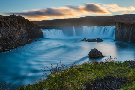 Godafoss waterfall, wild nature landscape, long exposure image, sunset in Icelandの写真素材