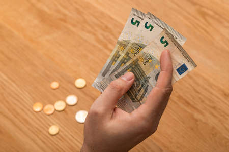 Close up of a man hand holding money banknotesの写真素材