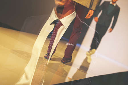 Fashion show with male models, abstract double exposure image. Business peopleの写真素材
