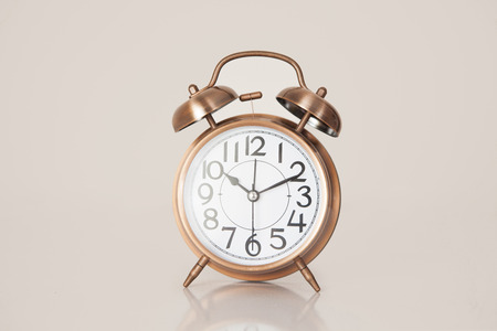 Retro alarm clock on a plain background closeupの写真素材