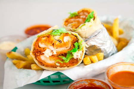Fried Crispy Chicken Burrito Served with French Friesの写真素材
