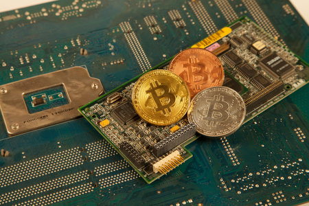 Bitcoin king of crypto currency on a computer background, Gold, Bronze and Silver