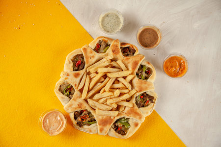 Philly cheese steak stuffed naan desi pizza cooked in wood fired oven, food fusion.