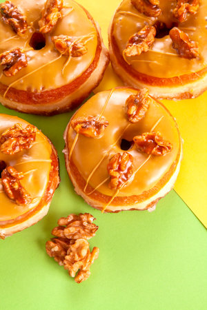 Gourmet three flavoured cinnamon, chocolate and maple walnut brioche doughnuts with ingredients.の写真素材