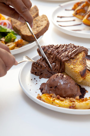 Chocolate french toast and banana slice served with chocolate gelato.の写真素材