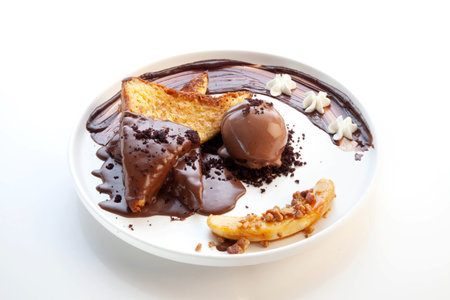 Chocolate french toast with a scoop of chocolate gelato ice cream on the side and banana sliced.の写真素材