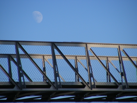 Moon in the background and modern bridge の写真素材