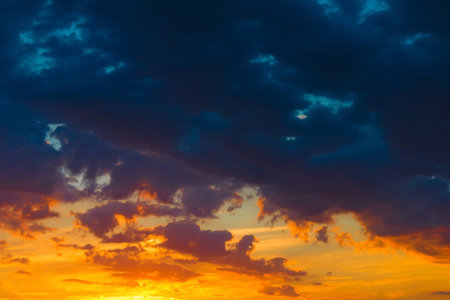 Beautiful heaven landscape, blue and orange clouds, amazing view on sunset, beauty of wonderful...