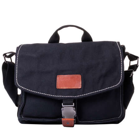 Men's bag made of black fabric. Bag with flap and metal lock. One handle and a wide textile shoulder strap.の写真素材