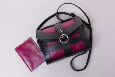 Set of crossbody bag and cover for passport. Black and purple colorsの写真素材