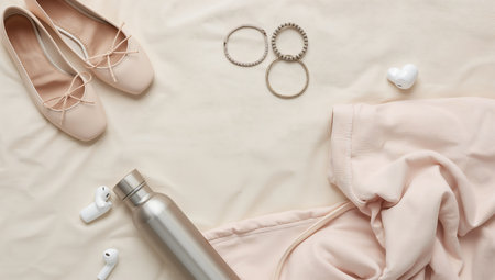 Flat lay composition with female accessories on beige background, top viewの素材