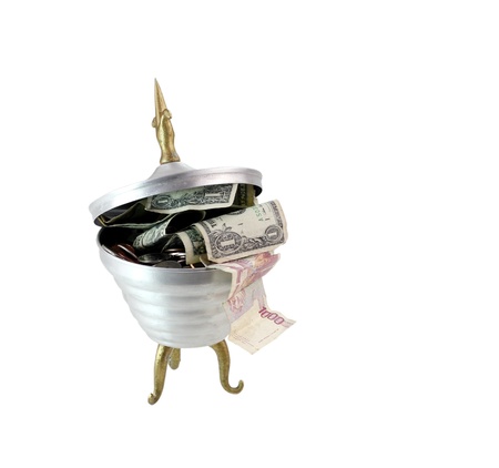 an unusual retro candy dish full of money isolated on white with a clipping pathの写真素材