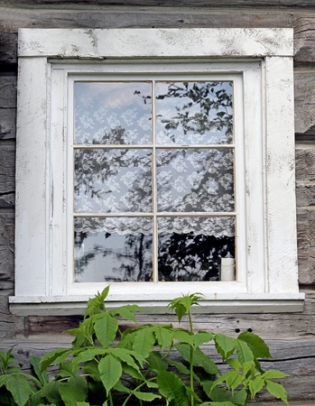 Old fashioned window with lace curtains の写真素材