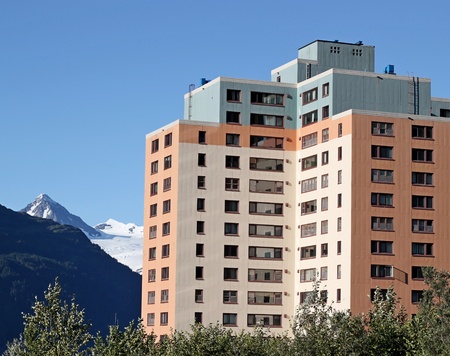 Colorful  building in Whittier Alaska  (the Begich Building, former army barracks)  on a sunny summer dayの写真素材