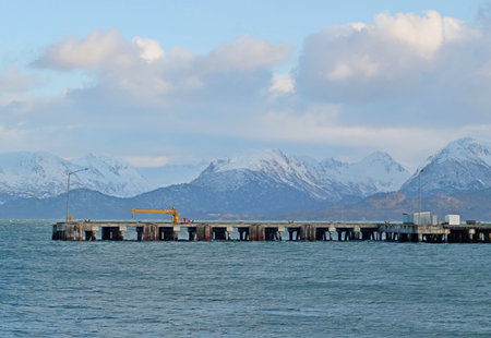 Empty commercial shipping dock in Homer, Alaska with clouds.