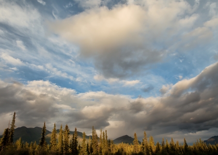 Clouds forming in the Wrangell-St. Elias National Park in Alaska on a summer evening.の写真素材