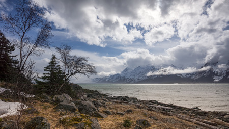 Dramatic clouds near the Chilkat Inlet in Alaska in winter.の写真素材