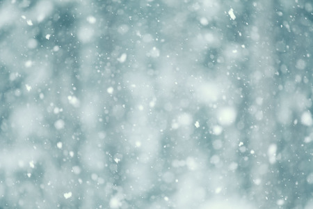 Snow falling abstract with a shallow depth of field for a dreamy look.の写真素材
