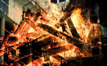 Double exposure of an old building and a burning structure.