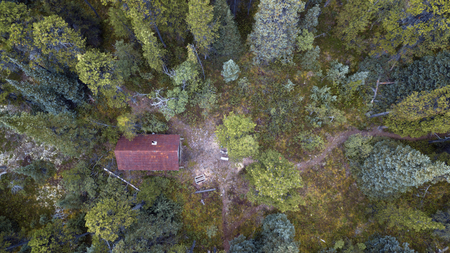 Aerial drone photo of a rustic Yukon Canadian cabin in the forest.の写真素材