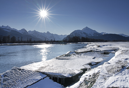 Ice melting on the Chilkat River in Southeast Alaska on a sunny day in spring.の写真素材