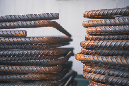 Deformed steel (Concrete reinforcement), with building under construction background, close-up steel...