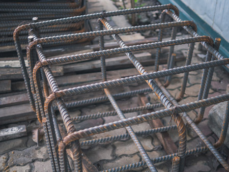 Bending steel bars according to construction drawings (Deformed steel) with the building under...