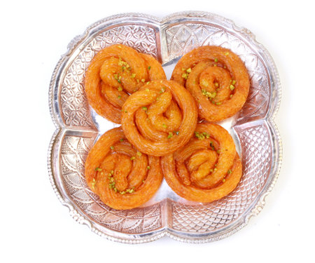 Indian sweet food jalebi or imrati on a plateの写真素材