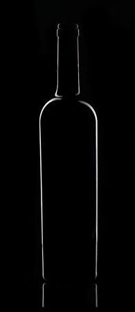 bottle of red wine in dark plaseの写真素材