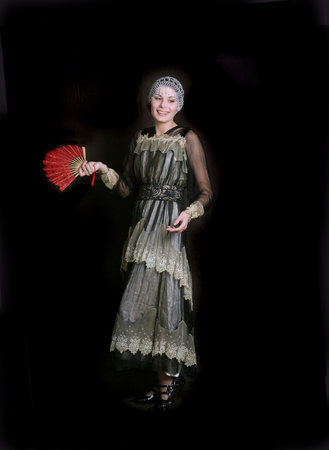 Standing girl with a red fan dress in  style of the beginning of XX century