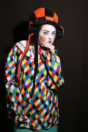 girl with clown makeup in funcy heatの写真素材