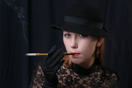 woman  in style of 1930-1940 with sigaretteの写真素材