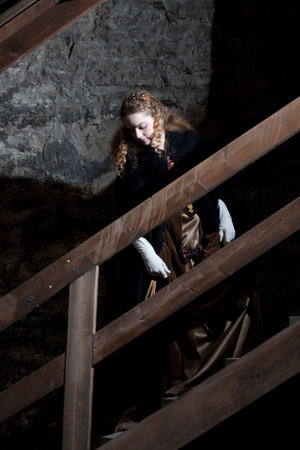 Renesaince style girl in old townの写真素材